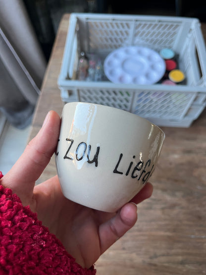 Kopje met quote - Wat zou liefde doen?