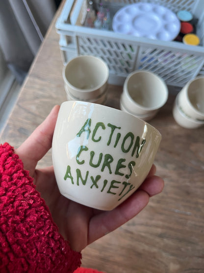 Kopje met quote - Action cures anxiety