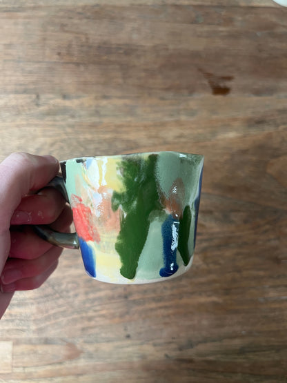 Kleurrijk koffiekopje met oor #2